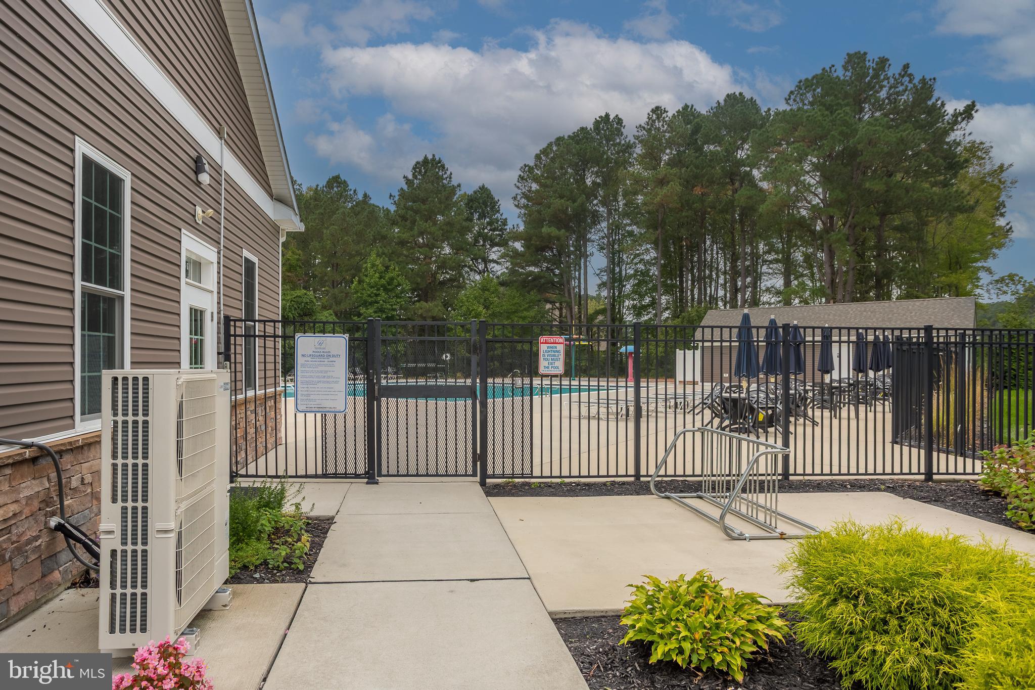 18308 Emerson Way Georgetown, DE 19947 - Photo 39 of 43 a view of a entrance with a garden