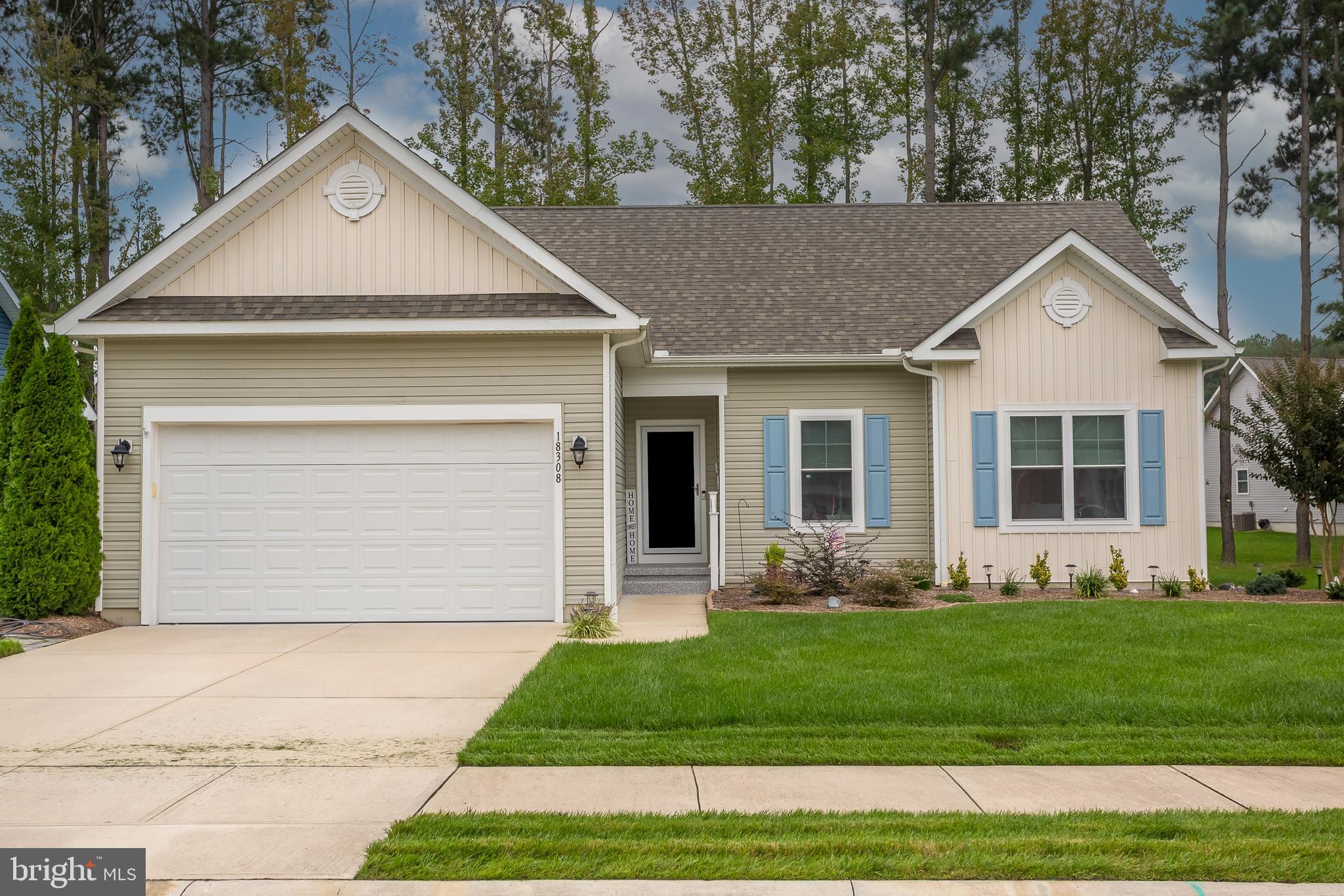 18308 Emerson Way Georgetown, DE 19947 - Photo 5 of 43 a front view of a house with a yard