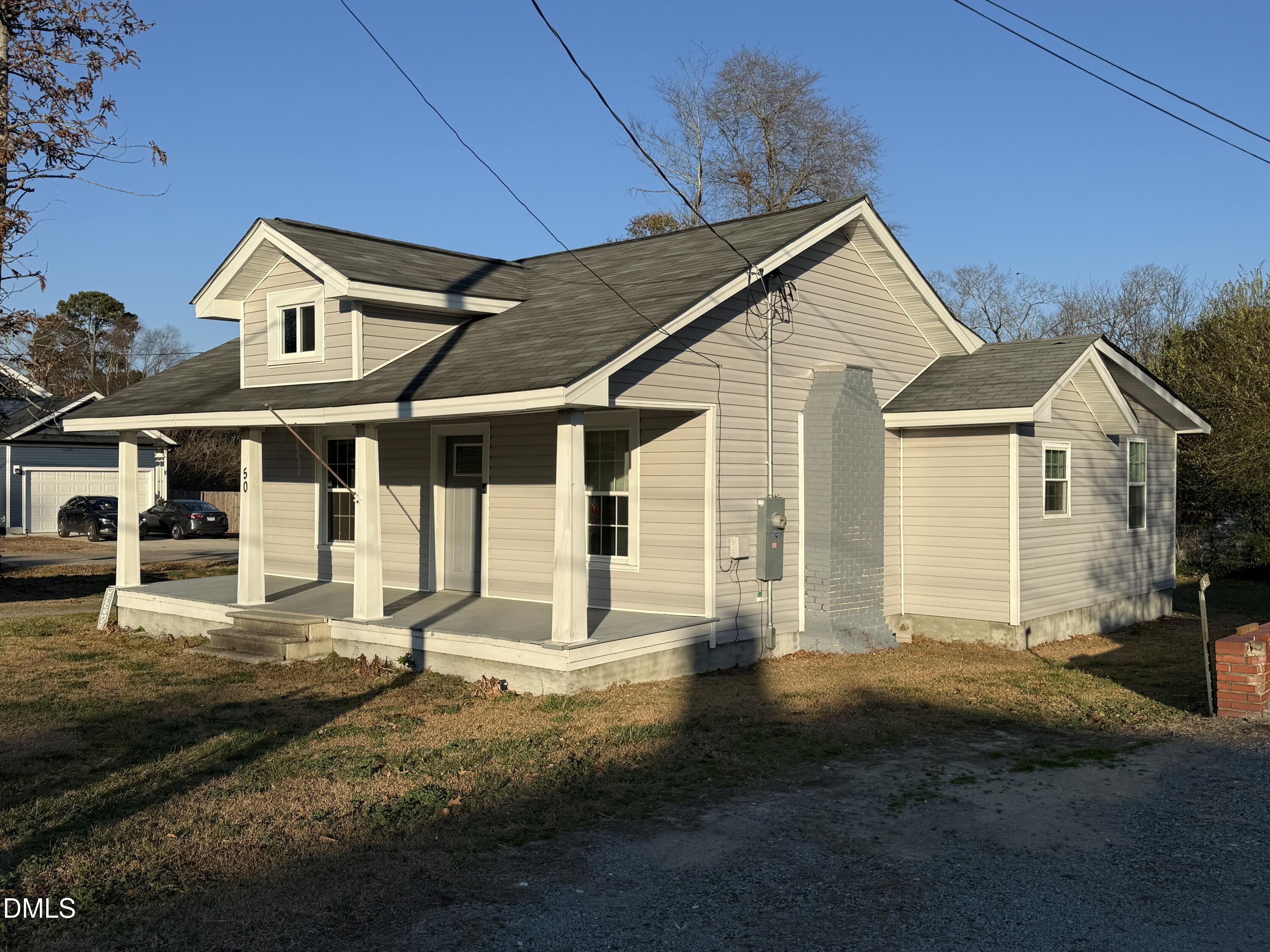 50 North Ida Street Coats, NC 27521 - Photo 2 of 10 a front view of a house with a yard