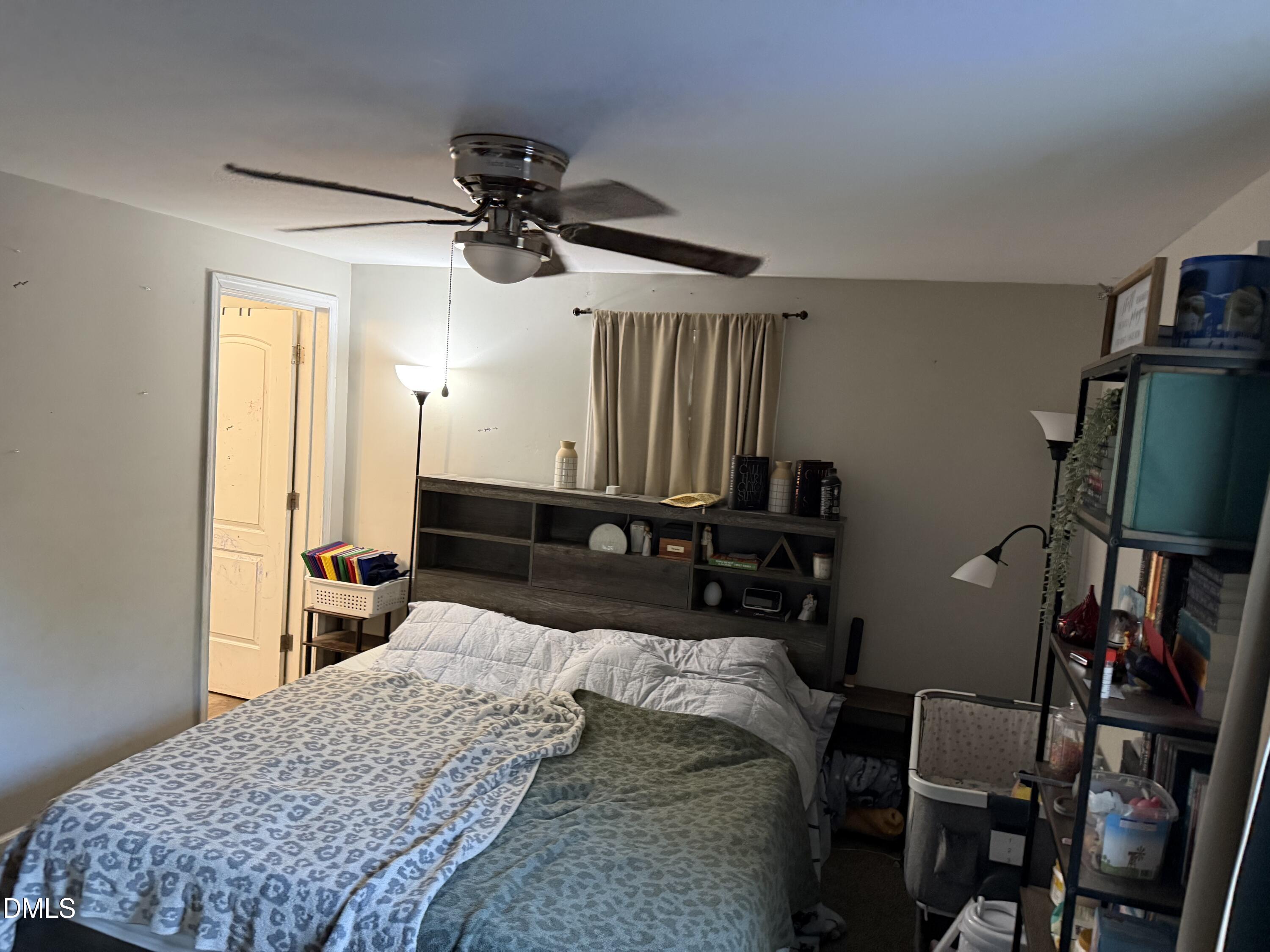 50 North Ida Street Coats, NC 27521 - Photo 6 of 10 a bedroom with a bed a desk and chair