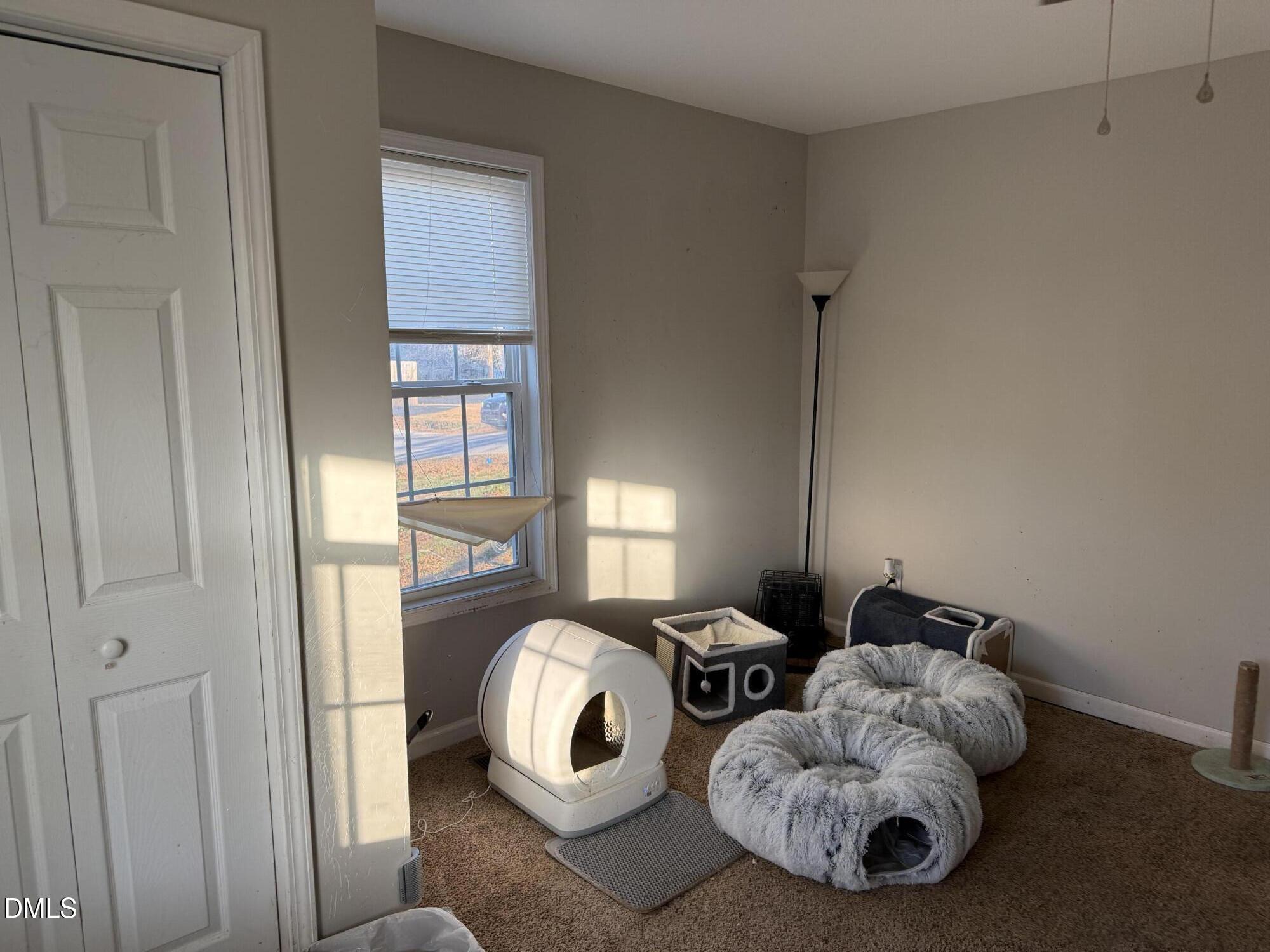 50 North Ida Street Coats, NC 27521 - Photo 8 of 10 a bed room with a bed and a window