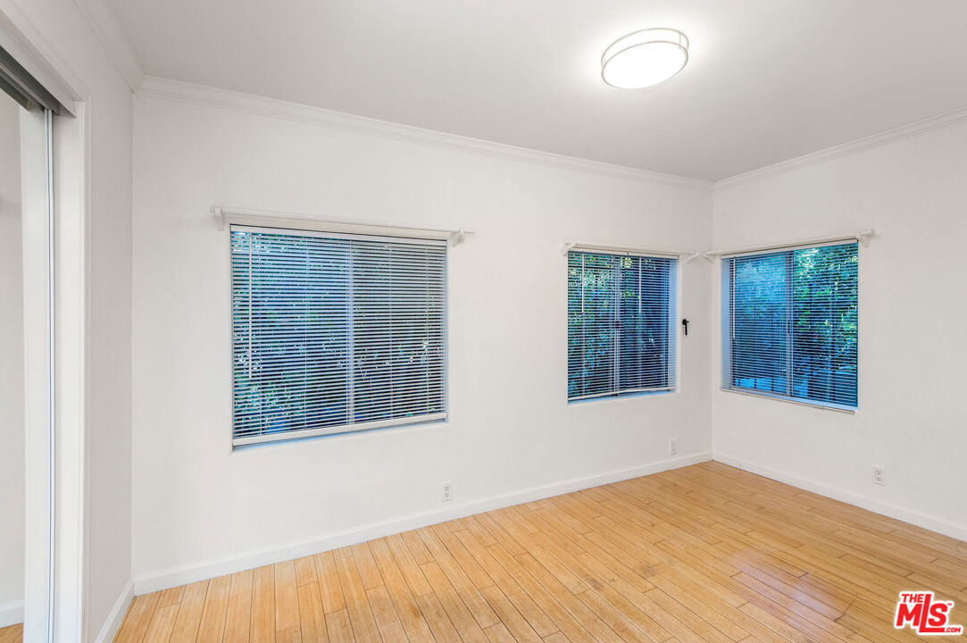 51 Ozone Avenue Venice, CA 90291 - Photo 6 of 11 a view of an empty room with wooden floor and a window
