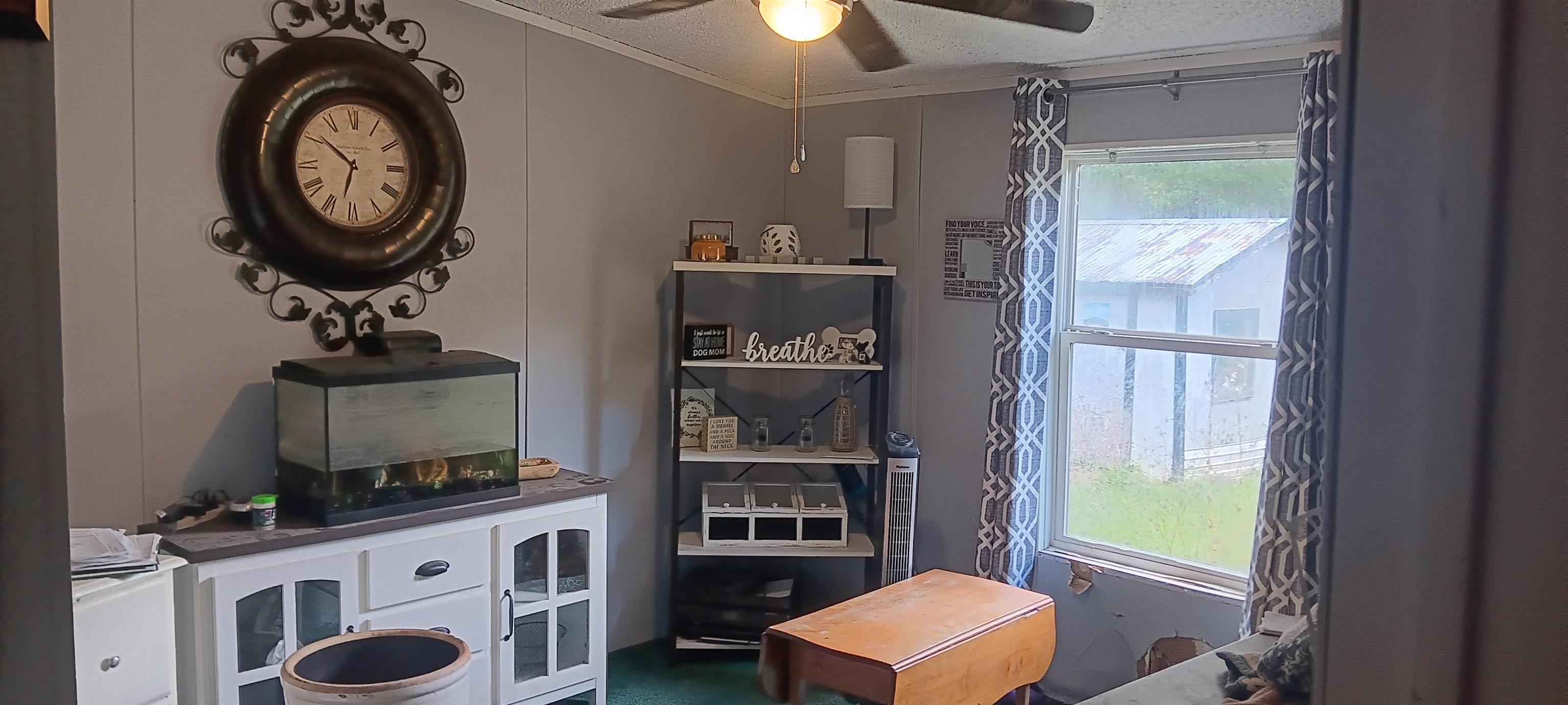 100 Academy Road Pulaski, TN 38478 - Photo 12 of 36 Detailed view of a textured ceiling, crown molding, and a ceiling fan