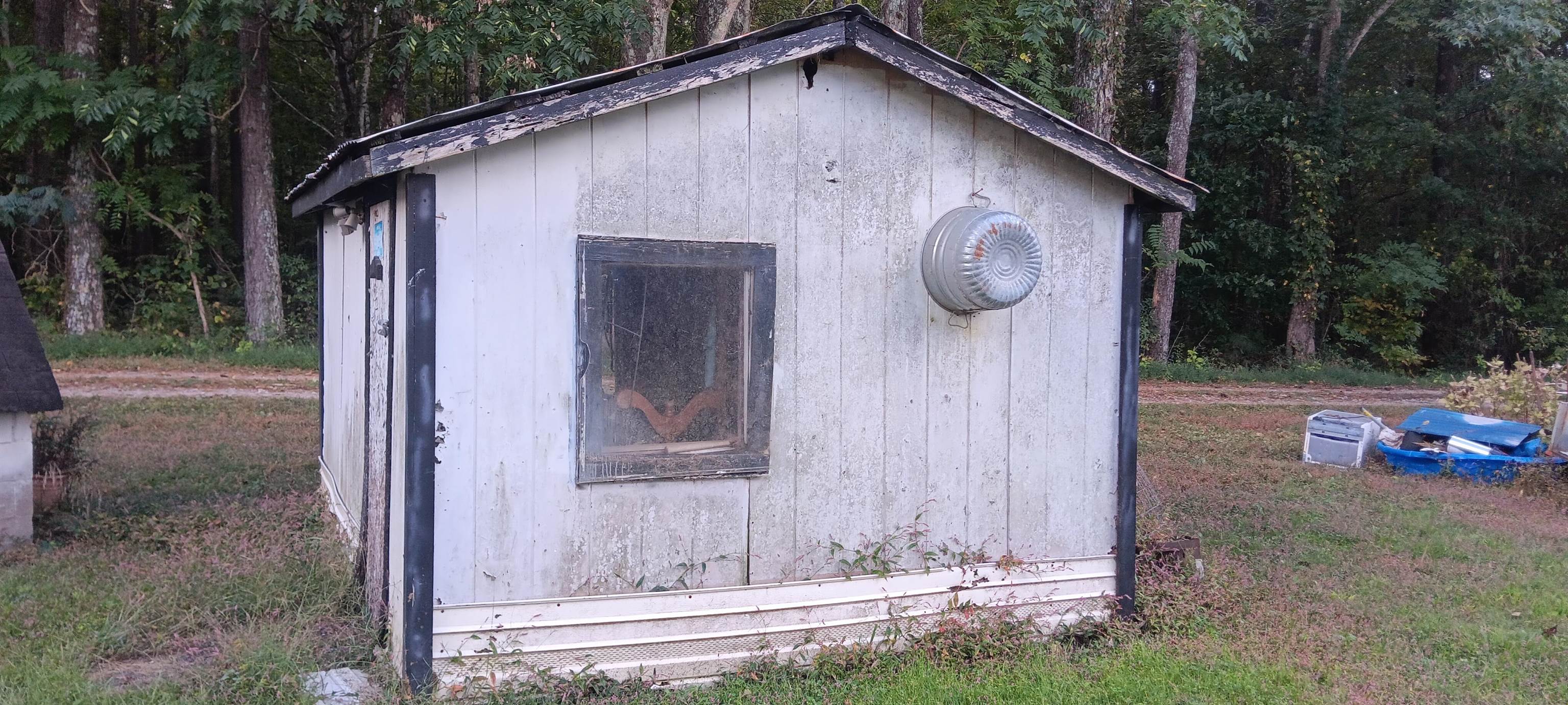 100 Academy Road Pulaski, TN 38478 - Photo 24 of 36 View of shed with a wooded view