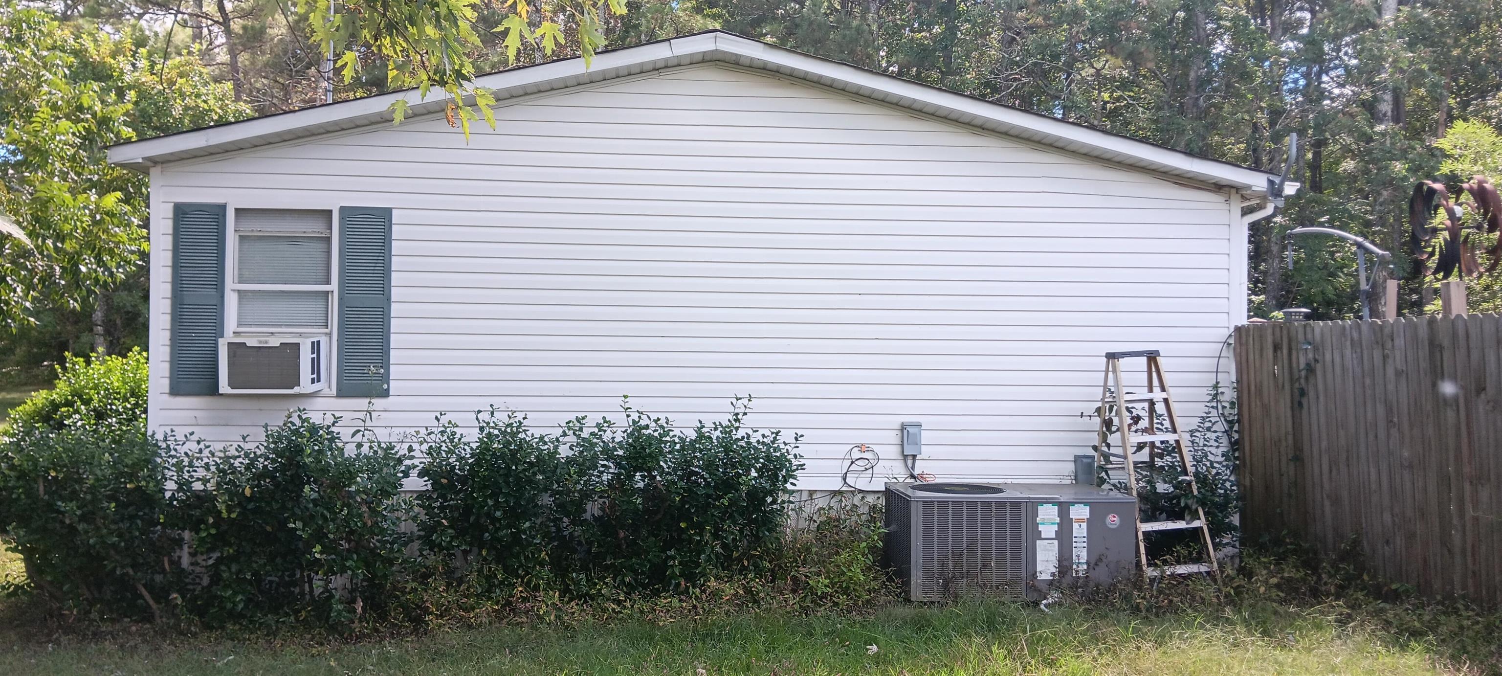 100 Academy Road Pulaski, TN 38478 - Photo 31 of 36 View of property exterior featuring a central air condition unit and cooling unit