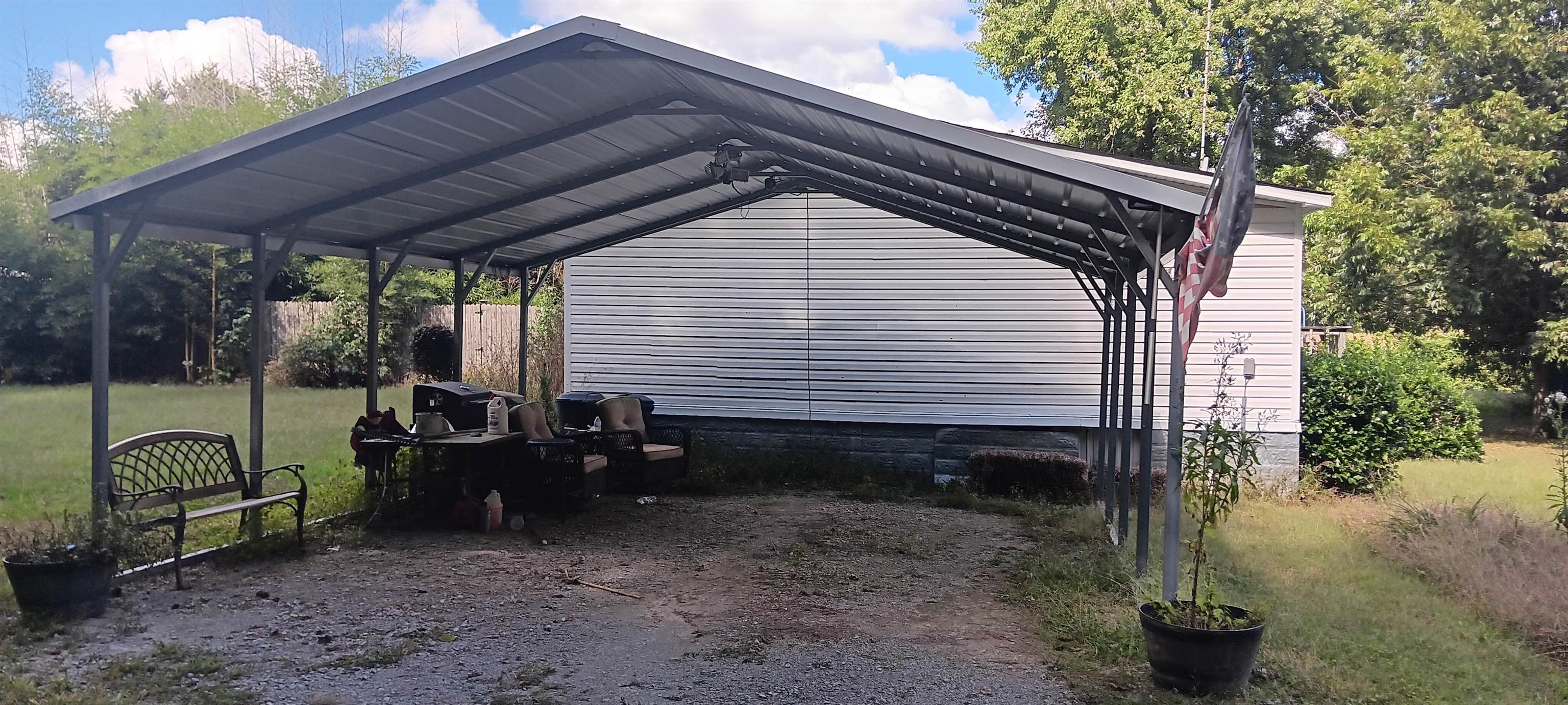 100 Academy Road Pulaski, TN 38478 - Photo 33 of 36 View of car parking featuring a carport