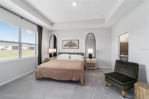 a bedroom with bed and window