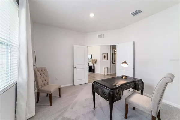 a living room with furniture and a window