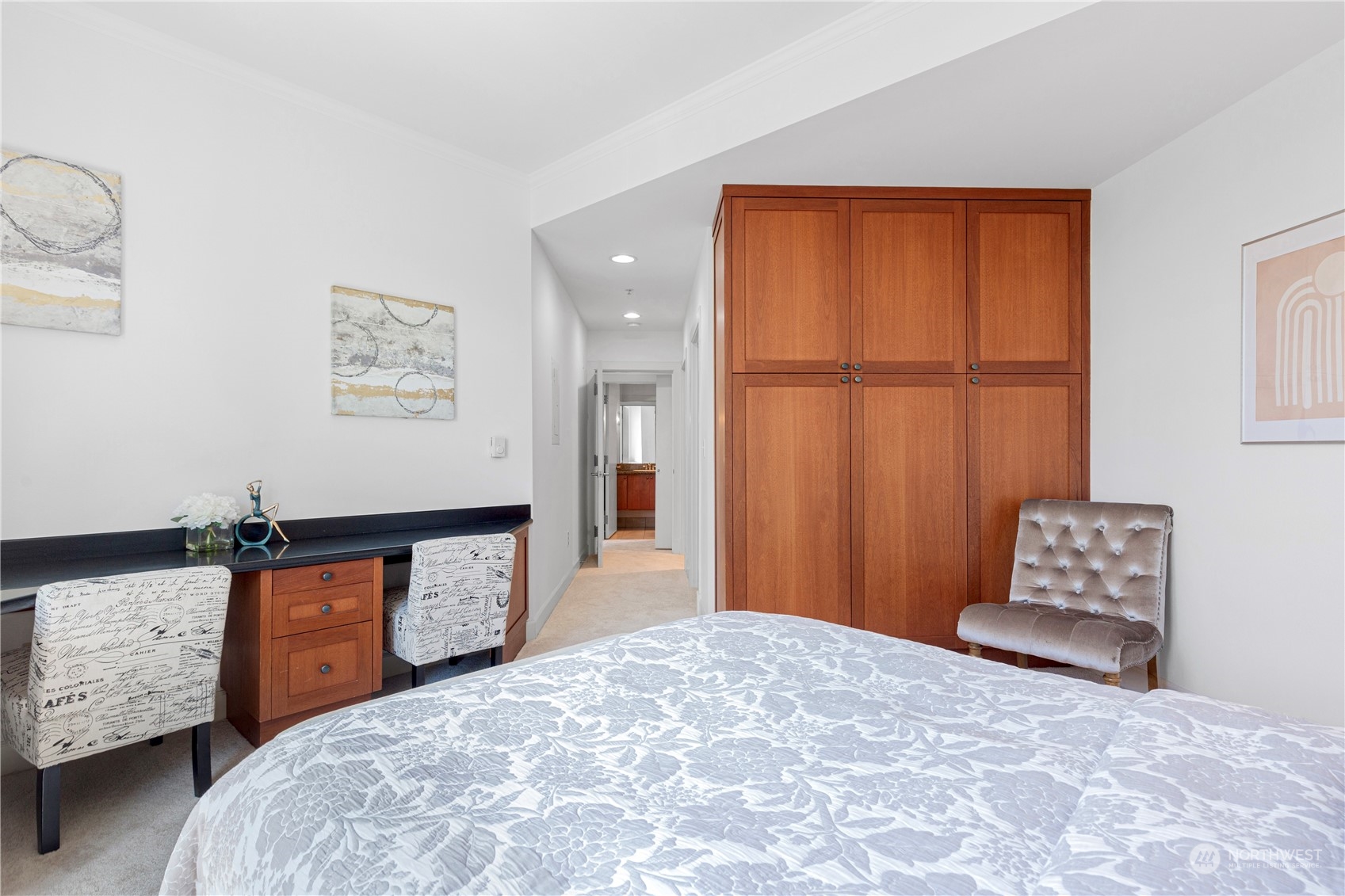 5000 30th Avenue Northeast, Unit 302 Seattle, WA 98105 - Photo 12 of 21 a bedroom with a bed and a dresser in it