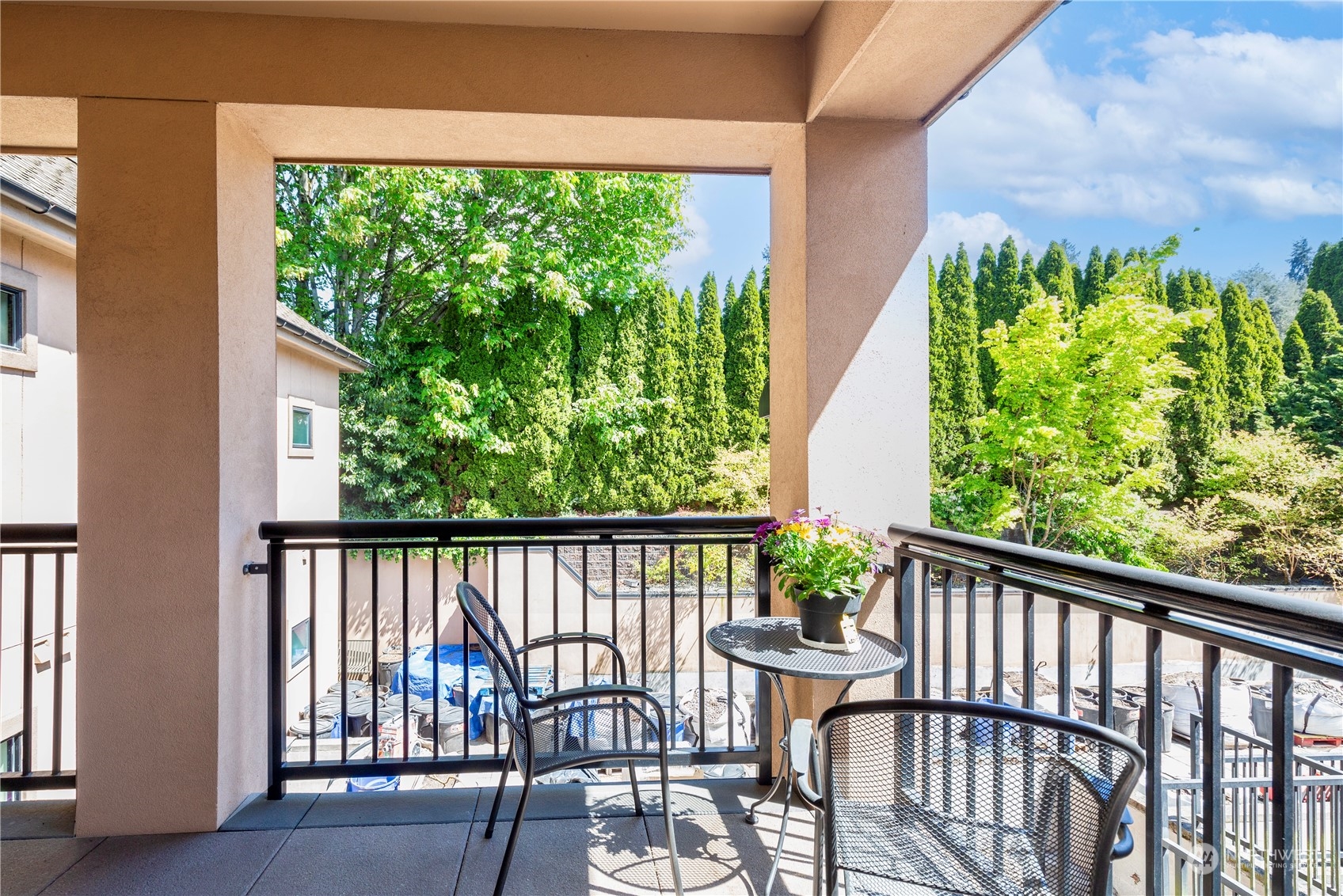 5000 30th Avenue Northeast, Unit 302 Seattle, WA 98105 - Photo 19 of 21 a view of a chair and table in the balcony