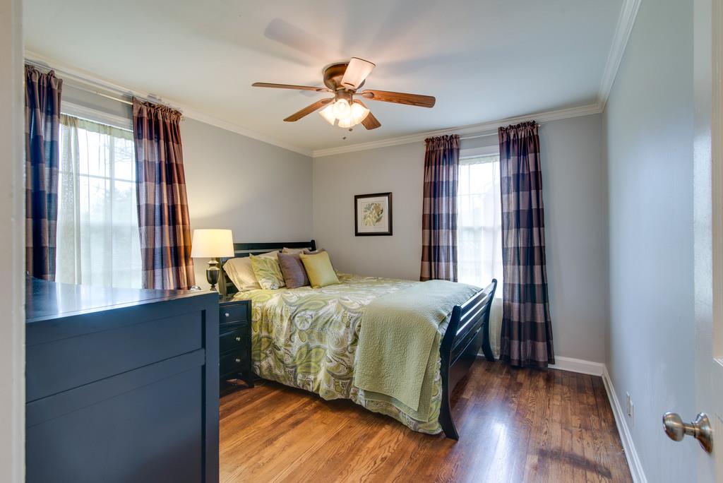 5561 Knob Road Nashville, TN 37209 - Photo 15 of 26 a bedroom with a bed and large windows