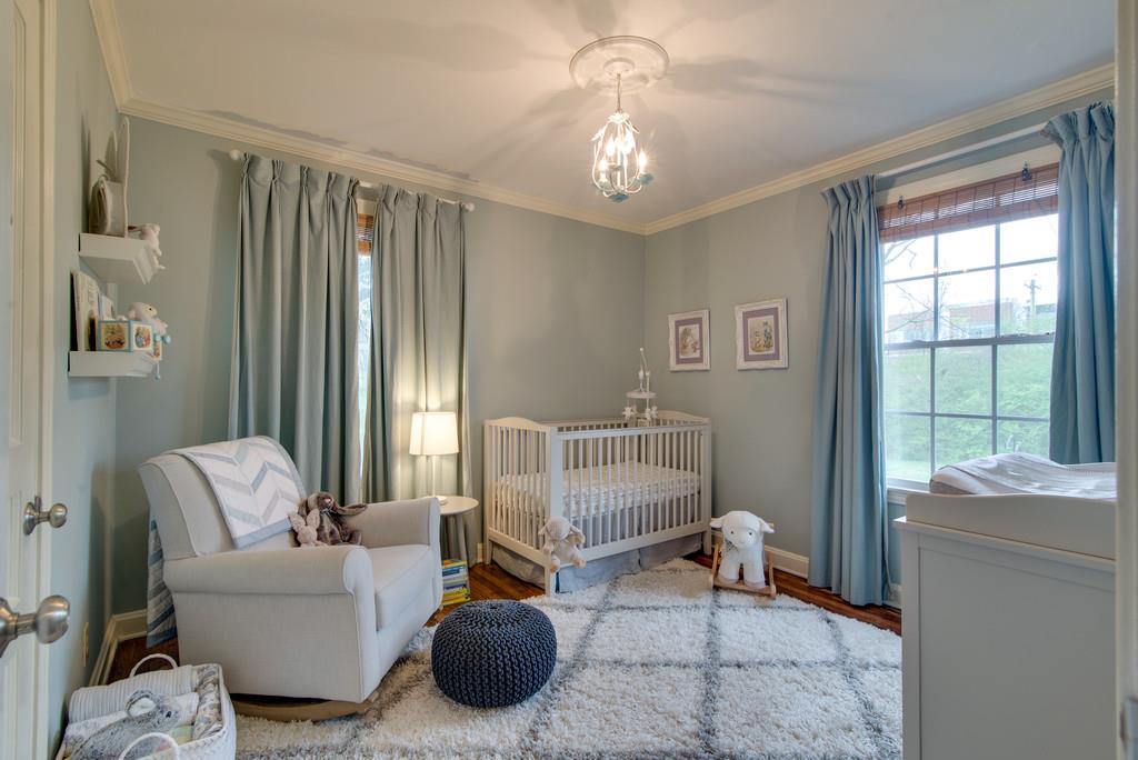 5561 Knob Road Nashville, TN 37209 - Photo 16 of 26 a living room with furniture and a chandelier