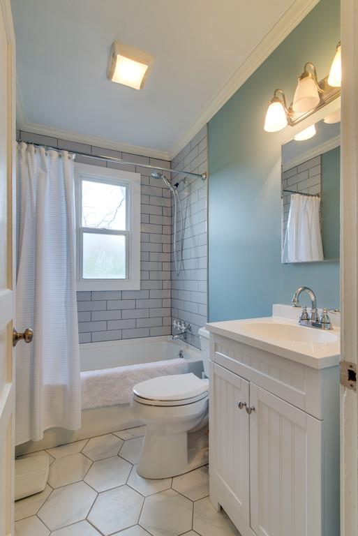5561 Knob Road Nashville, TN 37209 - Photo 18 of 26 a bathroom with a sink a toilet and shower