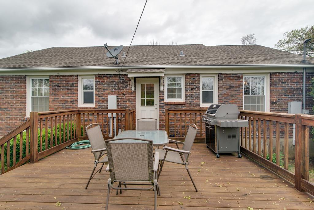 5561 Knob Road Nashville, TN 37209 - Photo 22 of 26 a view of a house with a deck and furniture