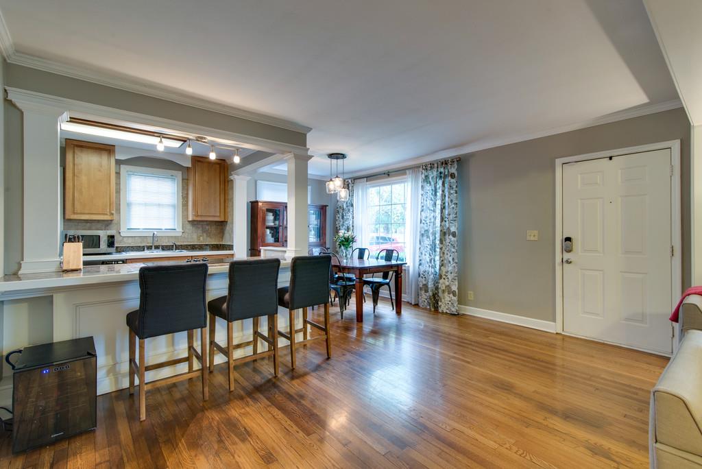 5561 Knob Road Nashville, TN 37209 - Photo 7 of 26 a view of a dining room with furniture and wooden floor