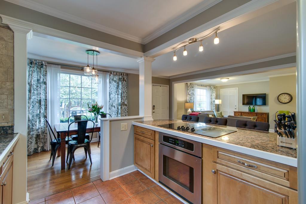 5561 Knob Road Nashville, TN 37209 - Photo 10 of 26 a kitchen with lots of counter top space and dining table