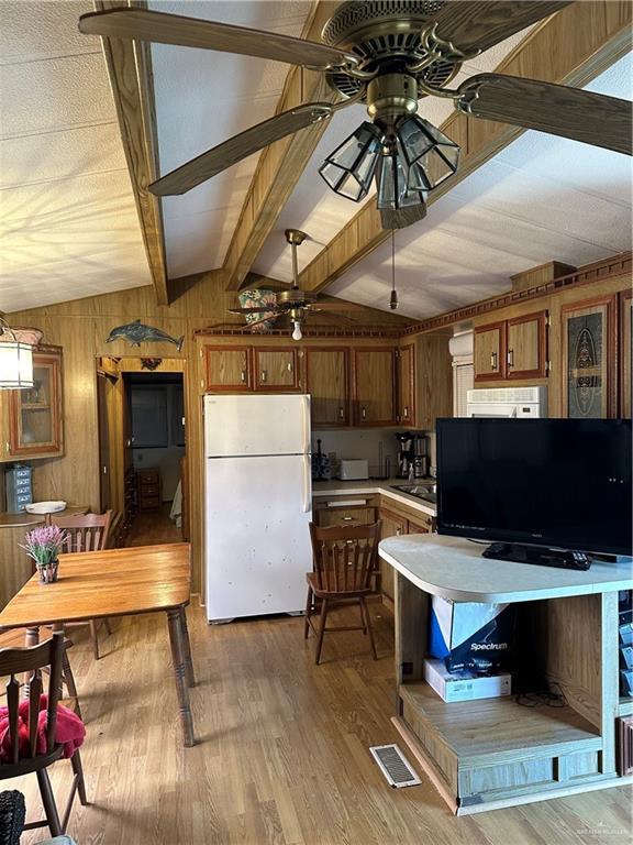 318 Sun Dial Circle Port Isabel, TX 78578 - Photo 2 of 8 a view of dinning room with wooden floor and furniture