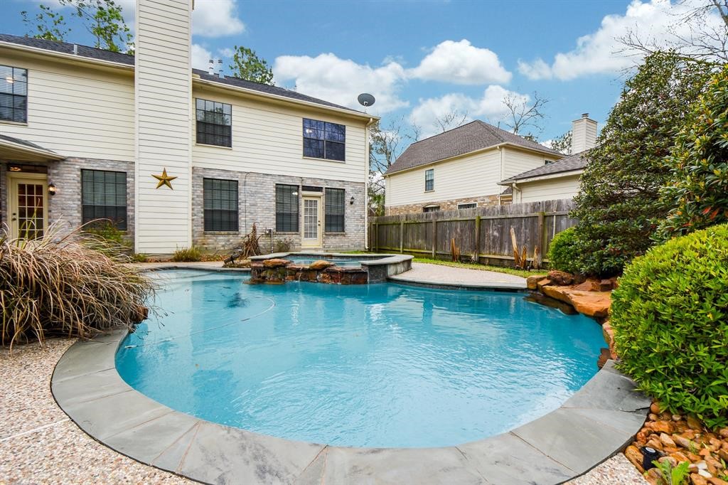 27 West Rumple Creek Place Spring, TX 77381 - Photo 31 of 32 The pool is the perfect spot to entertaining guests and cooling off during hot Summer days.