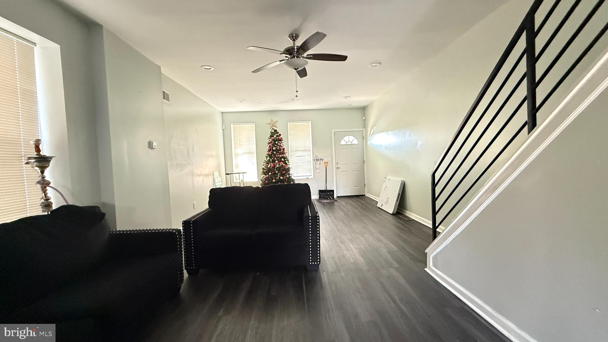 5129 Wakefield Street Philadelphia, PA 19144 - Photo 2 of 17 a living room with furniture and a chandelier