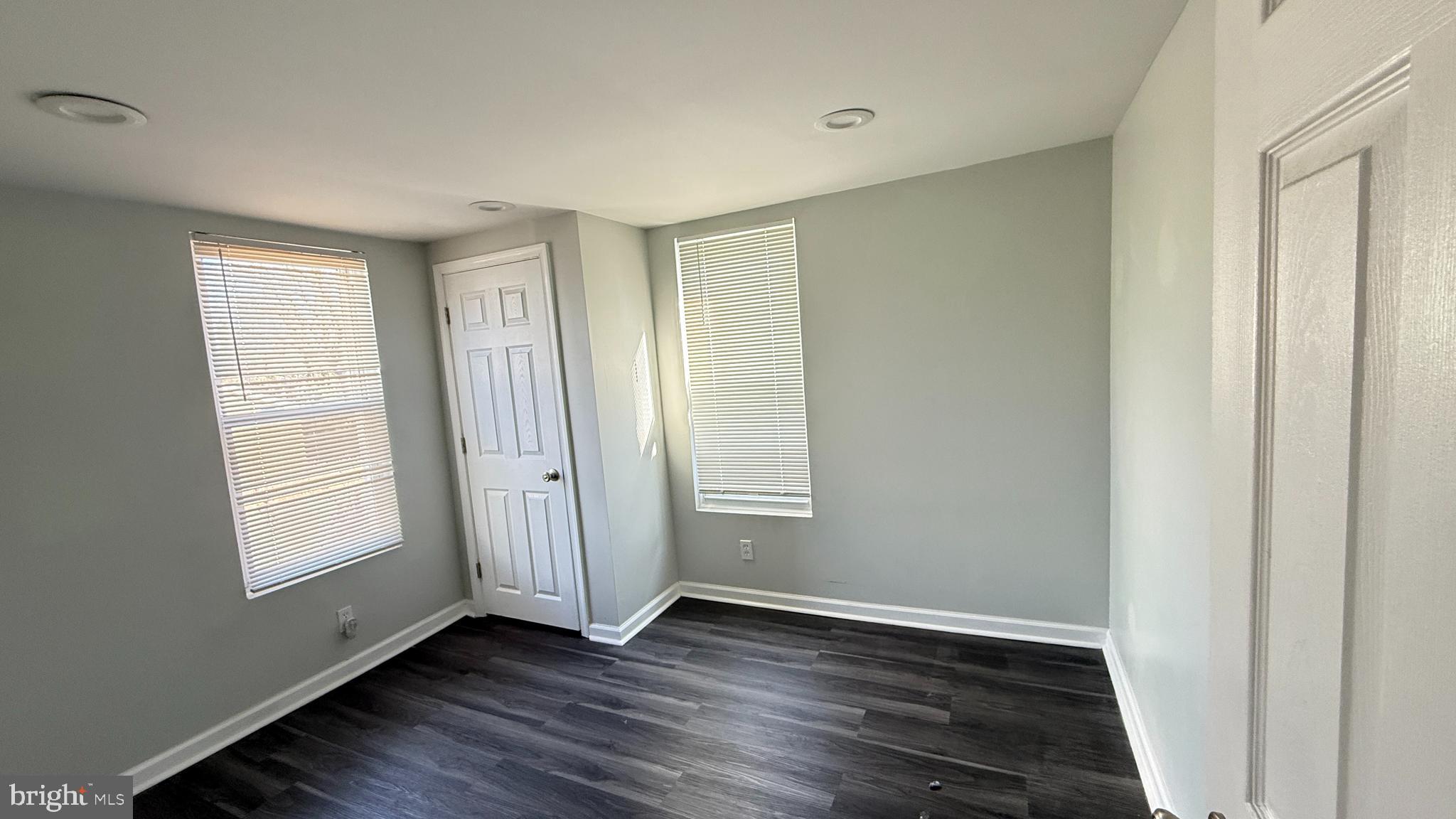 5129 Wakefield Street Philadelphia, PA 19144 - Photo 8 of 17 an empty room with wooden floor and windows