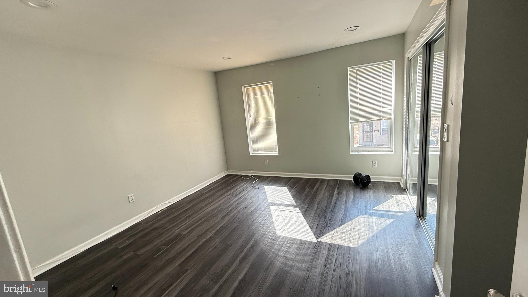 5129 Wakefield Street Philadelphia, PA 19144 - Photo 9 of 17 an empty room with wooden floor and windows