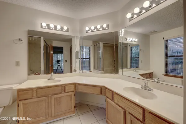 a bathroom with a bathtub and shower