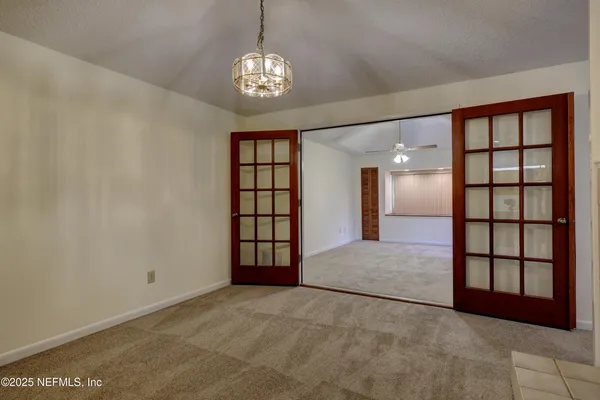 a view of an empty room with a window