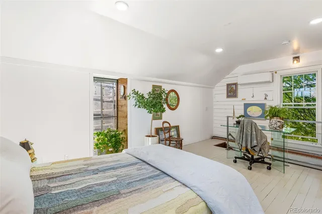 a vase of flowers sitting on a table and chair