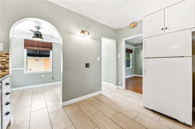 a view of a kitchen from the hallway
