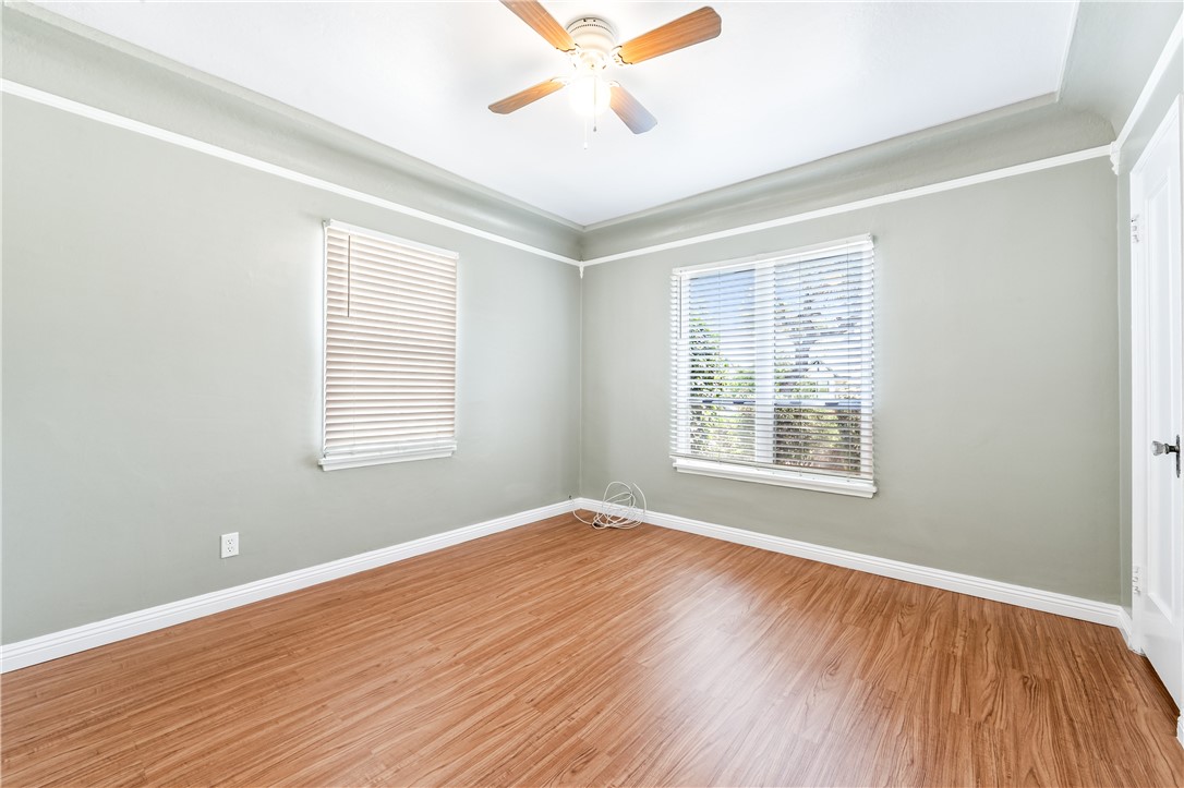 2109 Chestnut Avenue Long Beach, CA 90806 - Photo 24 of 32 a view of an empty room with wooden floor and a window
