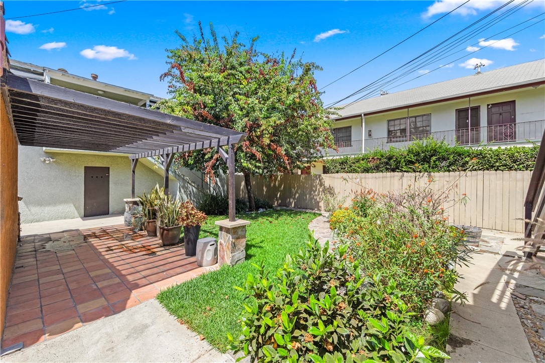 2109 Chestnut Avenue Long Beach, CA 90806 - Photo 29 of 32 a view of a house with backyard sitting area and garden