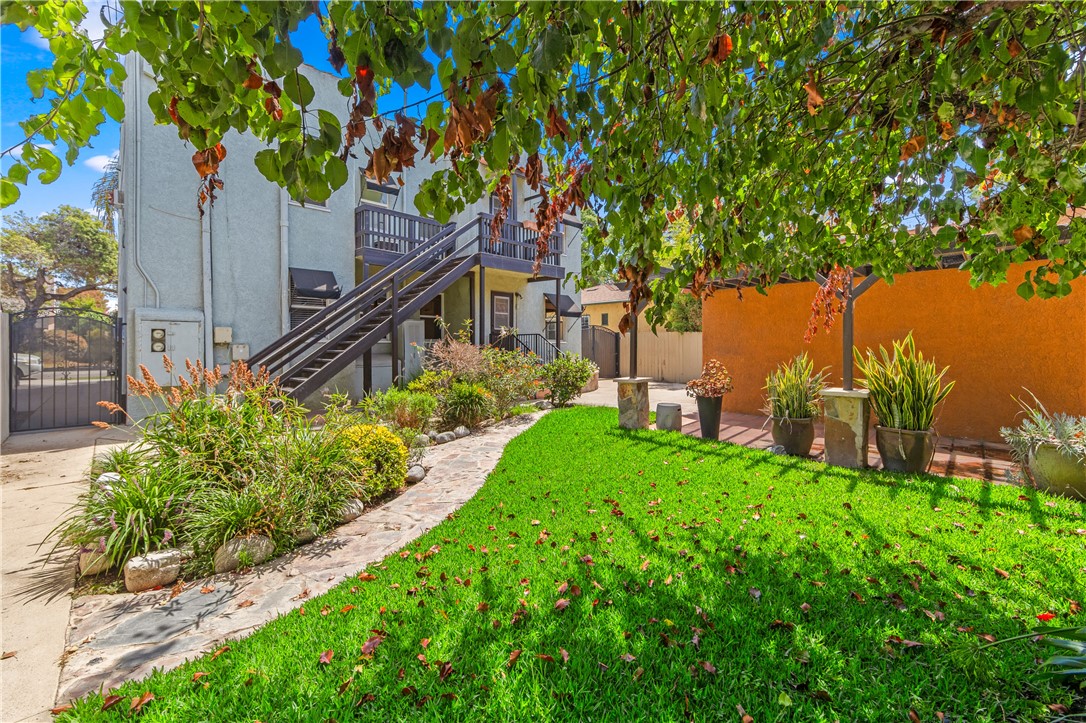2109 Chestnut Avenue Long Beach, CA 90806 - Photo 30 of 32 a view of a house with a yard and a tree