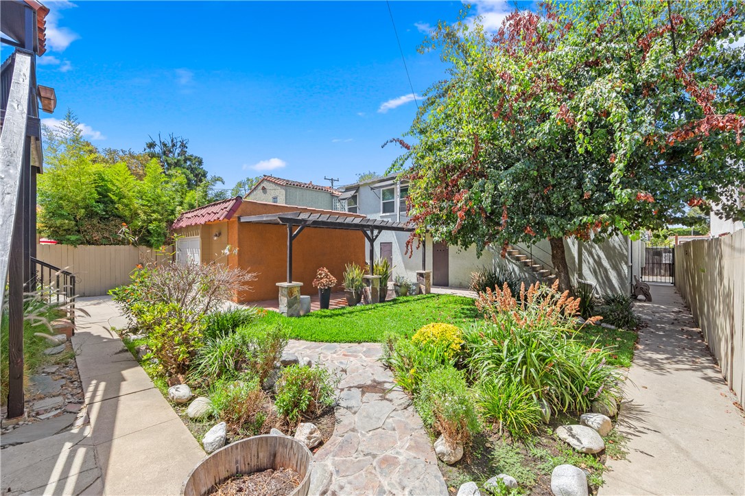 2109 Chestnut Avenue Long Beach, CA 90806 - Photo 31 of 32 a front view of a house with a yard