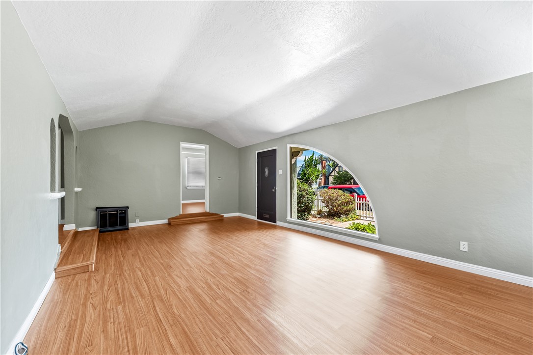 2109 Chestnut Avenue Long Beach, CA 90806 - Photo 8 of 32 an empty room with wooden floor and a window