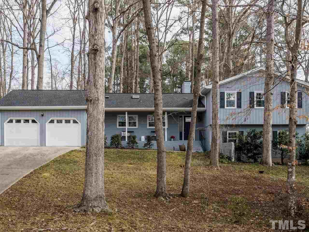 4109 Oak Park Road Raleigh, NC 27612 - Photo 1 of 28 a front view of a house with garden