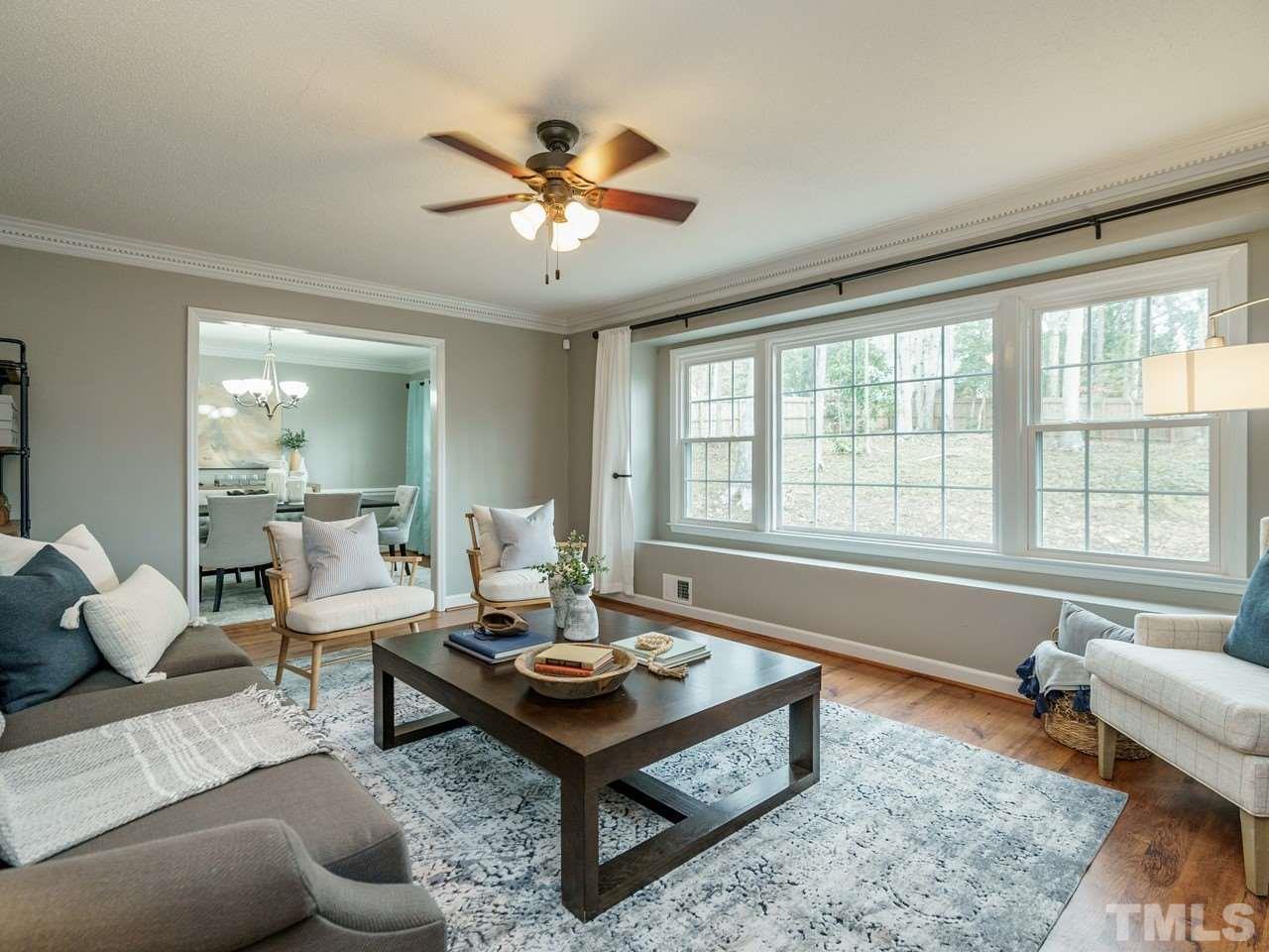 4109 Oak Park Road Raleigh, NC 27612 - Photo 3 of 28 a living room with furniture and a large window