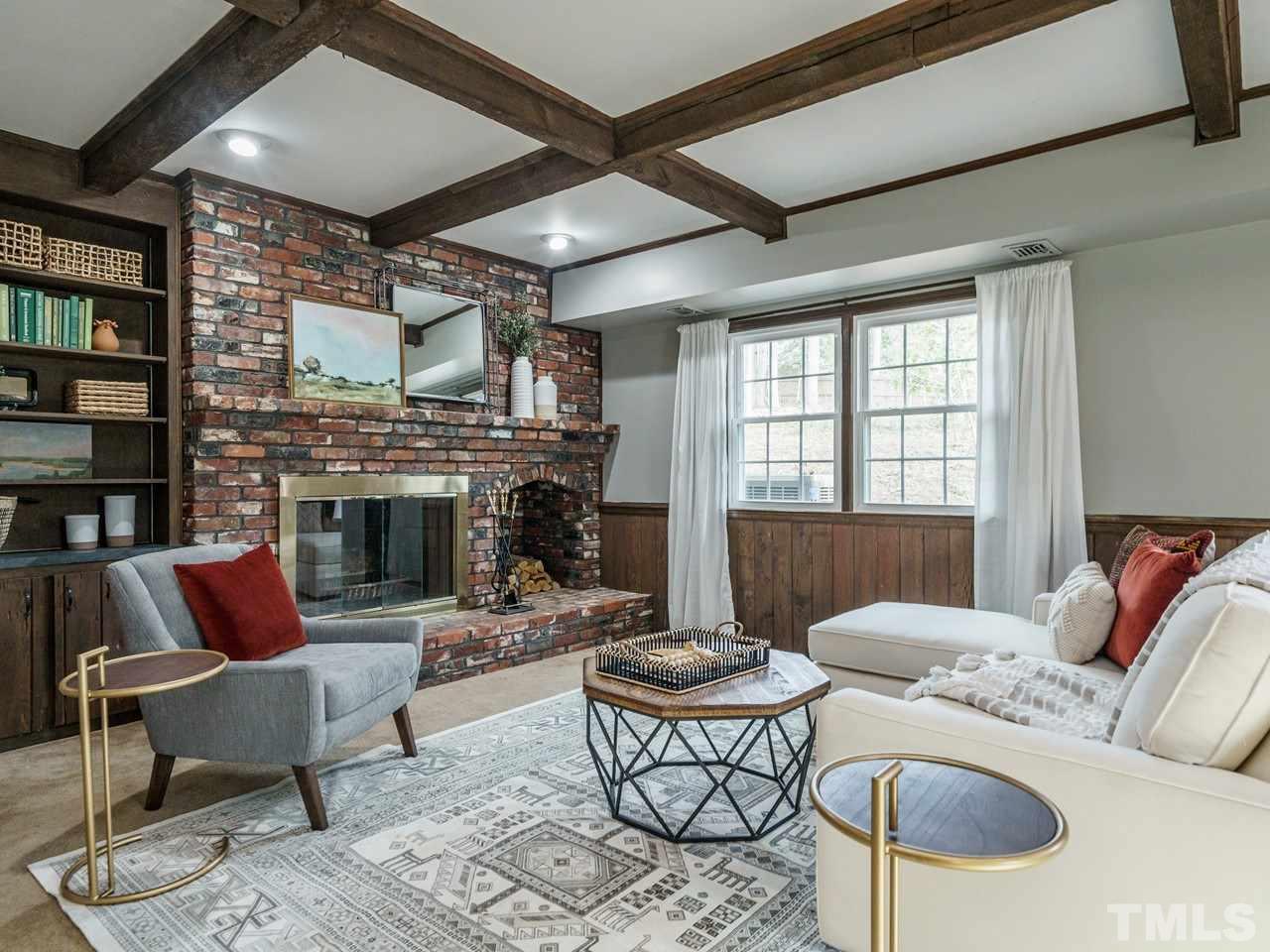 4109 Oak Park Road Raleigh, NC 27612 - Photo 21 of 28 a living room with furniture and a fireplace