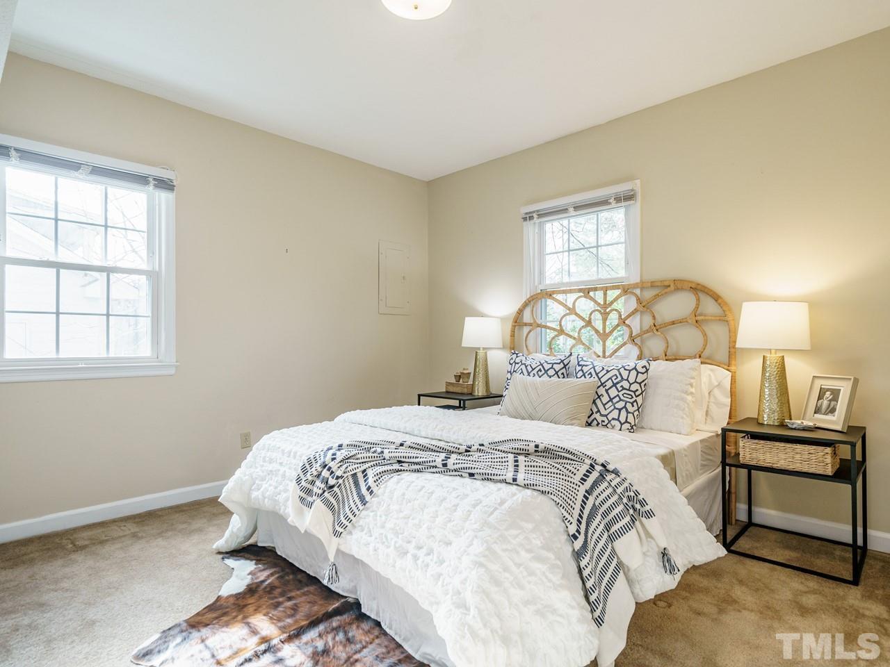 4109 Oak Park Road Raleigh, NC 27612 - Photo 24 of 28 a bedroom with a bed and a window