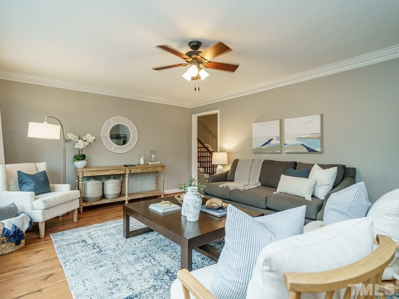 4109 Oak Park Road Raleigh, NC 27612 - Photo 4 of 28 a living room with furniture and a rug