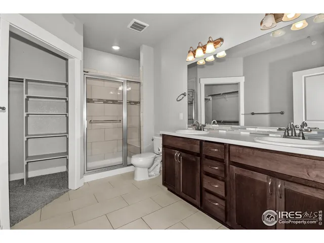 a bathroom with a sink vanity and a mirror