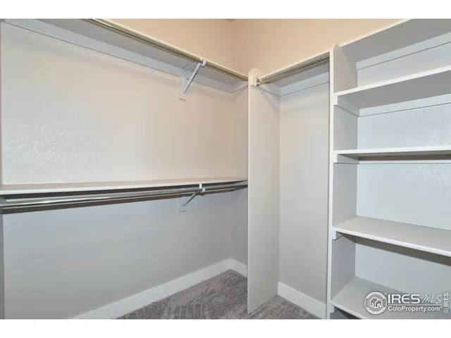 a view of an empty walk in closet