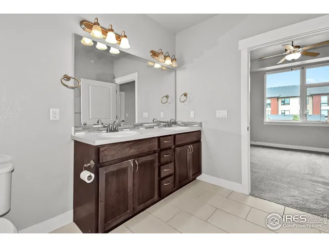 a bathroom with a sink vanity and a mirror