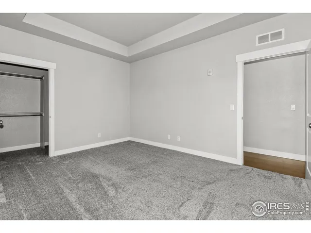 a view of an empty room and entryway