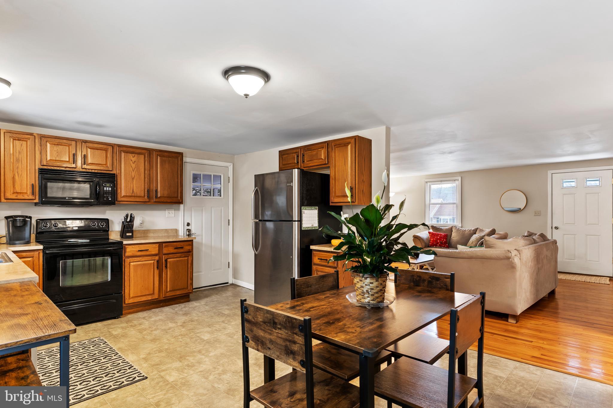 539 West Cumberland Road Enola, PA 17025 - Photo 11 of 26 a living room with stainless steel appliances furniture dining table and kitchen view