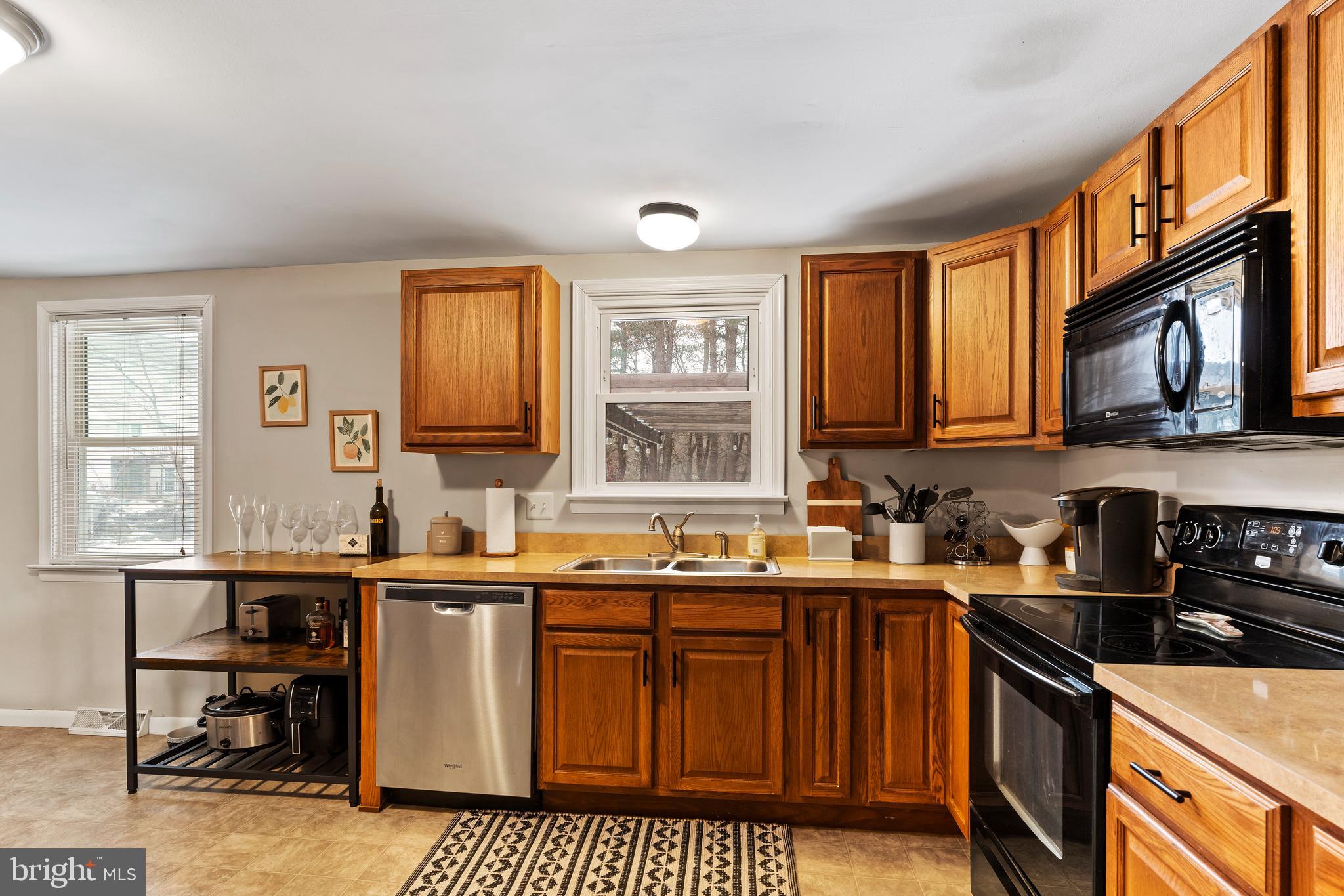 539 West Cumberland Road Enola, PA 17025 - Photo 12 of 26 a kitchen with stainless steel appliances a sink stove and cabinets