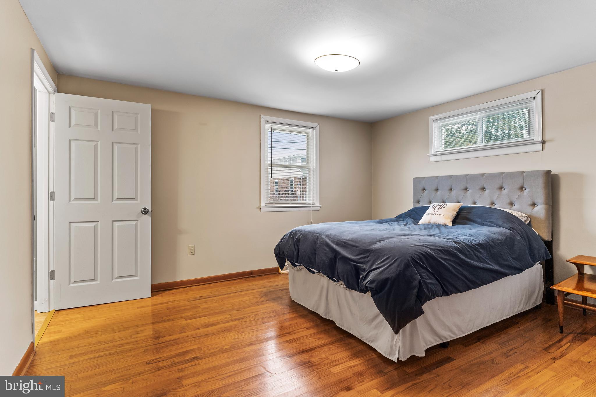 539 West Cumberland Road Enola, PA 17025 - Photo 14 of 26 a spacious bedroom with a bed and wooden floor