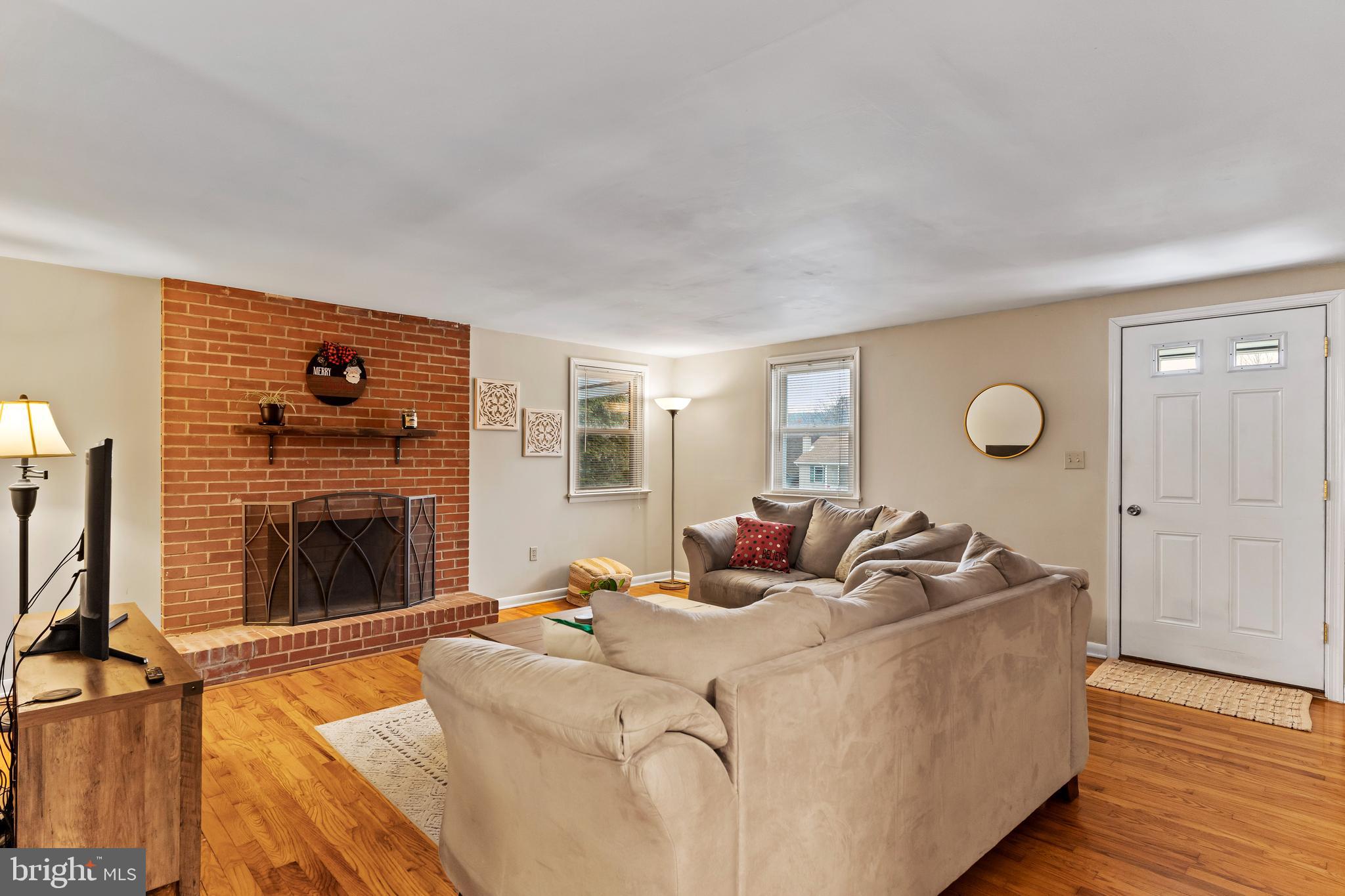 539 West Cumberland Road Enola, PA 17025 - Photo 7 of 26 a living room with furniture and a fireplace