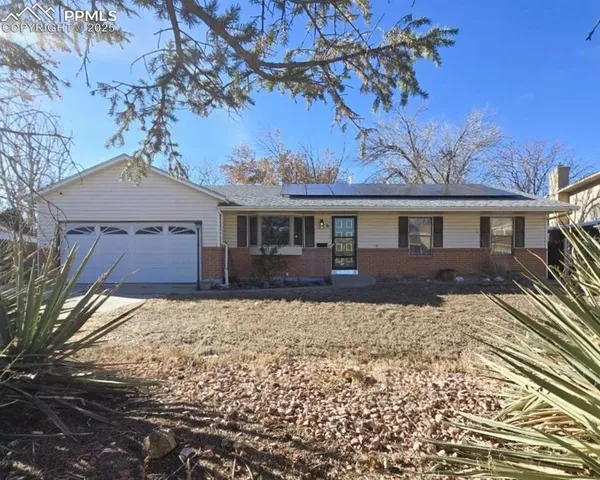 a house with trees in the background