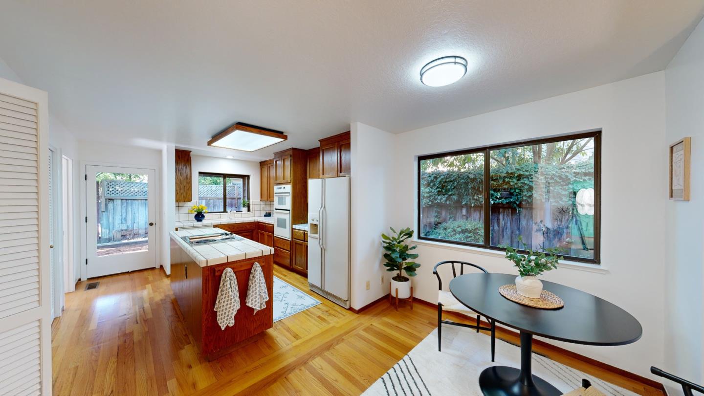 4493 Merlin Way Soquel, CA 95073 - Photo 14 of 52 a workspace with furniture and a potted plant