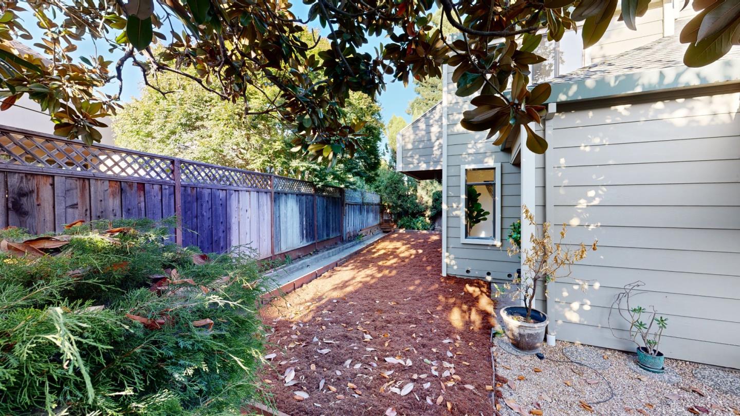 4493 Merlin Way Soquel, CA 95073 - Photo 21 of 52 a view of a backyard with potted plants and large tree